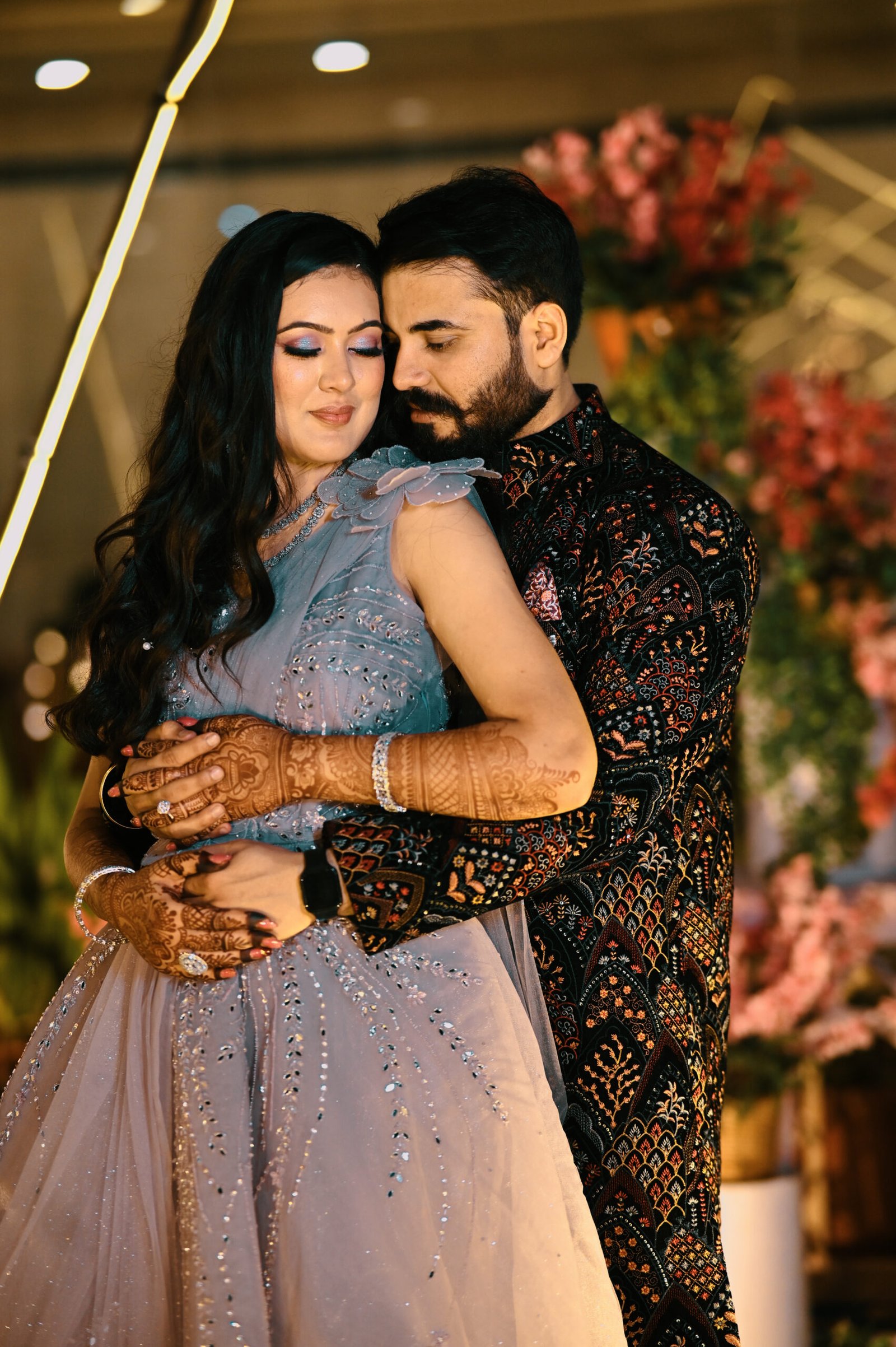 Bride and groom portrait with festive Rajasthani decor