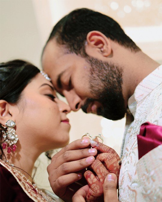 Close-up of couple during ring ceremony
